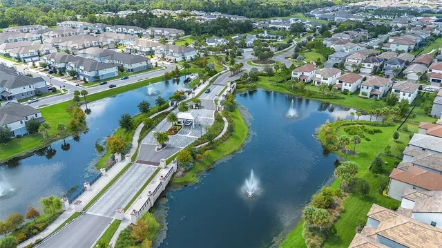 a living room with patio furniture and a flat screen tv