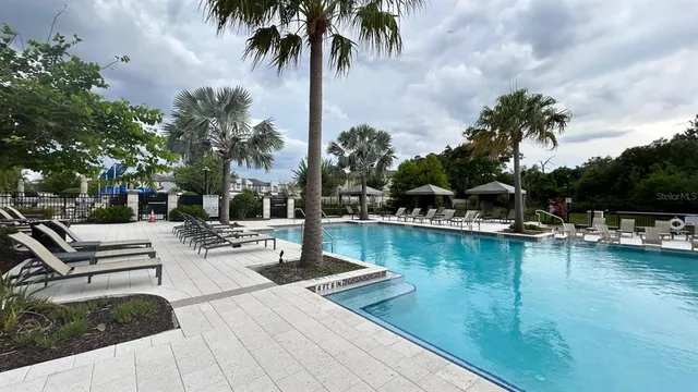 a view of a two chair and table in the garden