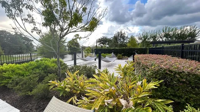 a view of a park with swings and slides