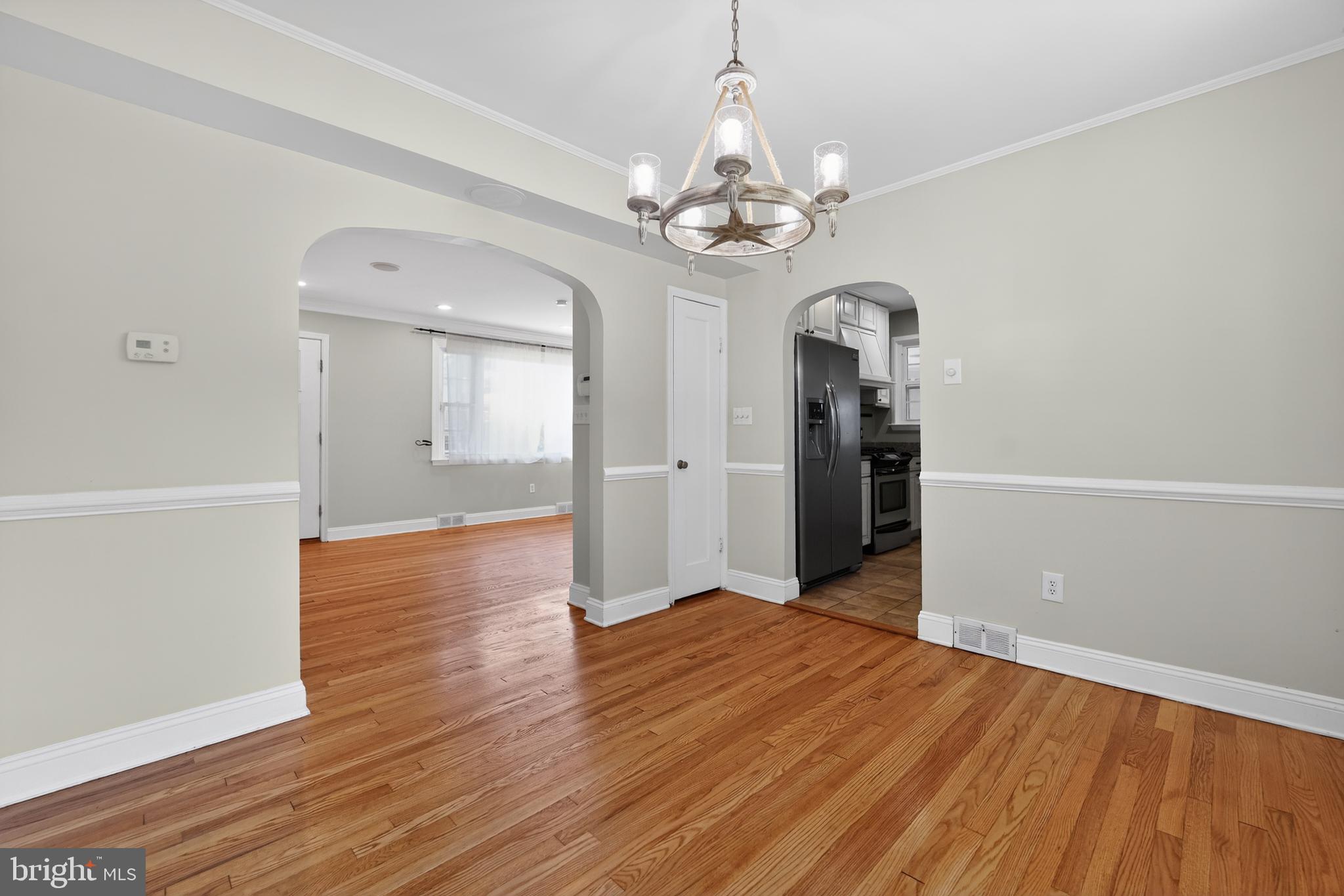 9408 Dana Vista Road Baltimore, MD 21236 - Photo 19 of 38 wooden floor in an empty room with a window