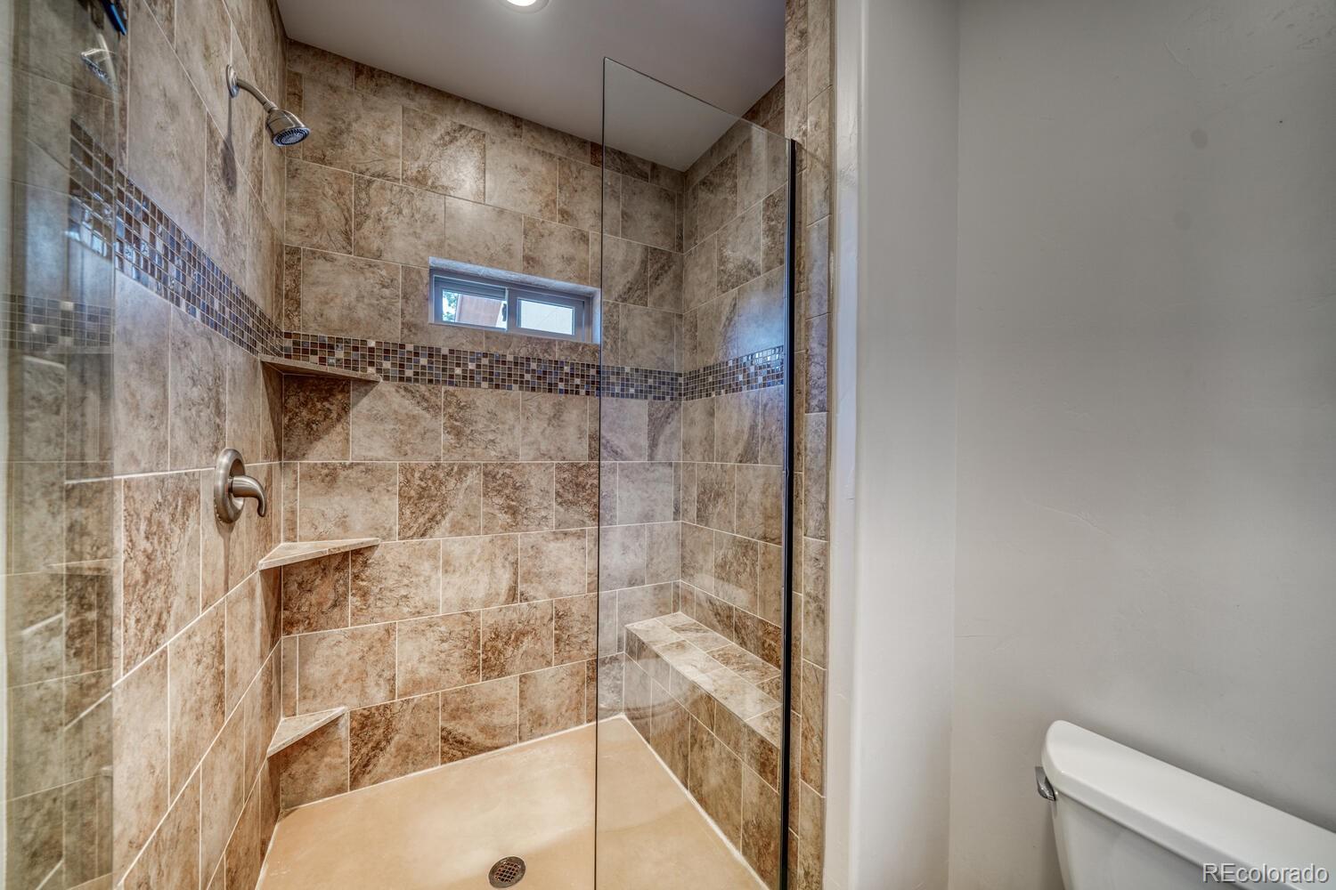 3561 Singletree Road Hartsel, CO 80449 - Photo 16 of 48 a bathroom with a shower and a toilet