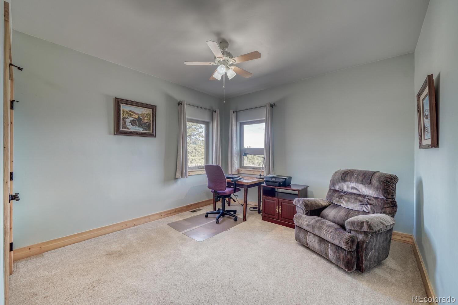 3561 Singletree Road Hartsel, CO 80449 - Photo 20 of 48 a living room with furniture and a window