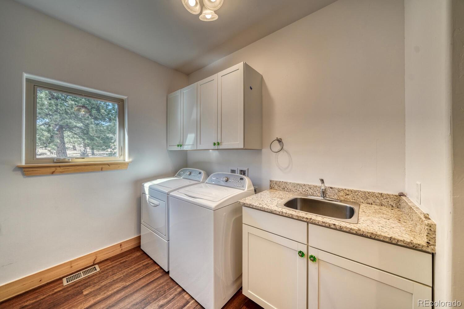 3561 Singletree Road Hartsel, CO 80449 - Photo 22 of 48 a view of a storage and utility room with washer and dryer