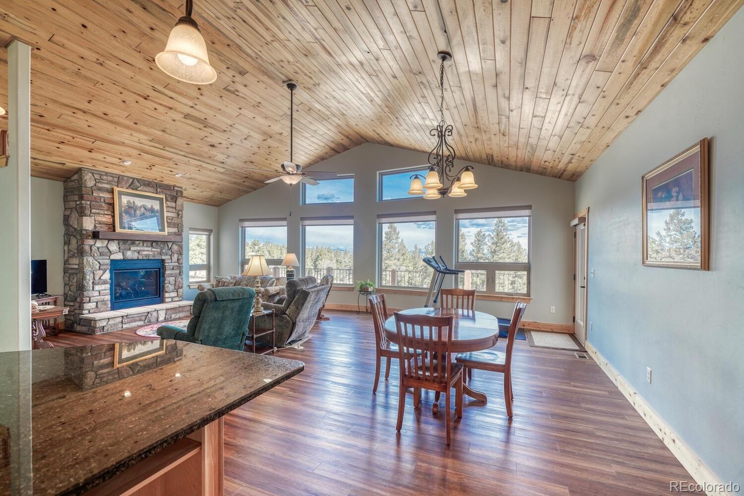 3561 Singletree Road Hartsel, CO 80449 - Photo 7 of 48 a view of a dining room with furniture window and wooden floor