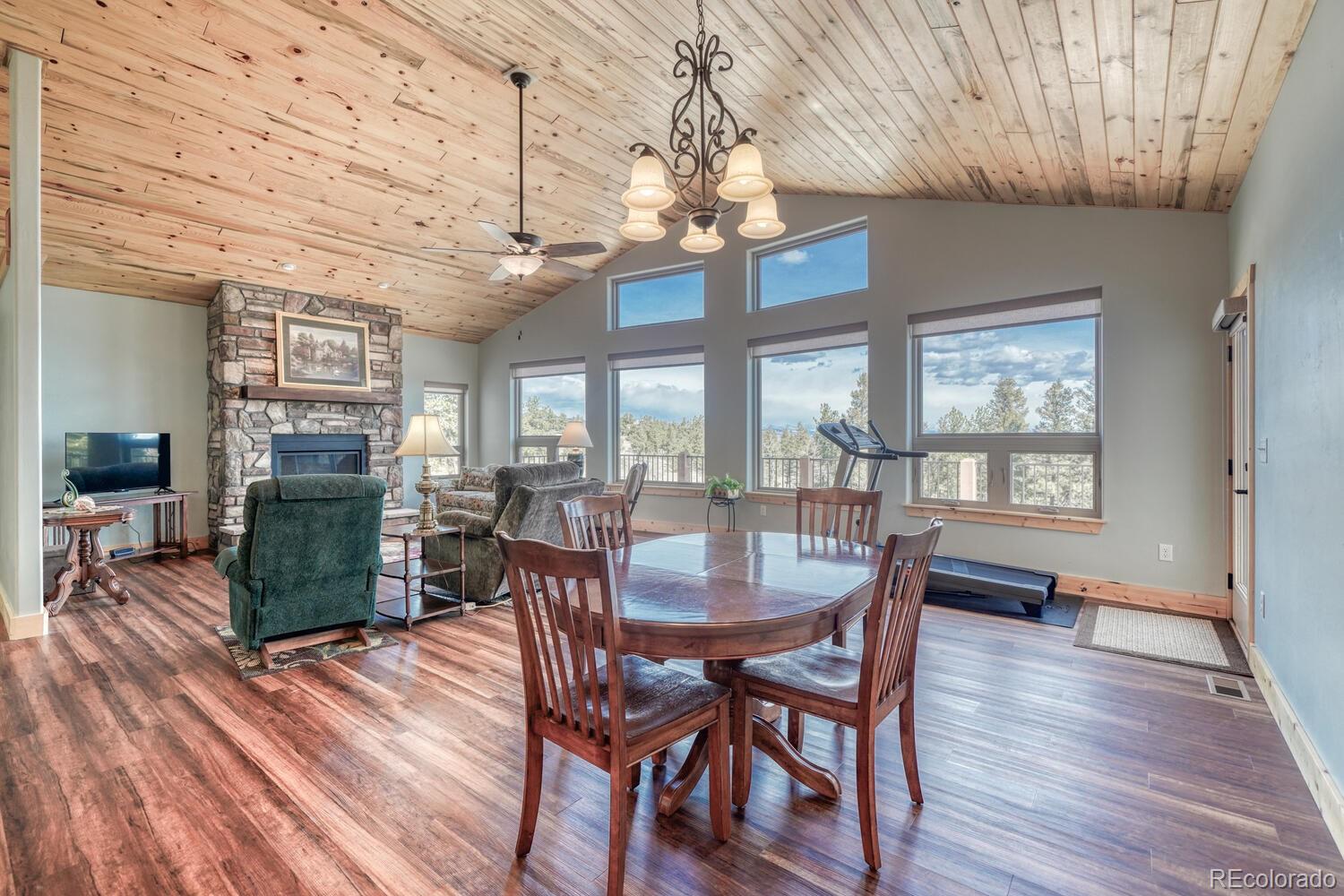 3561 Singletree Road Hartsel, CO 80449 - Photo 8 of 48 a dining room with furniture window wooden floor