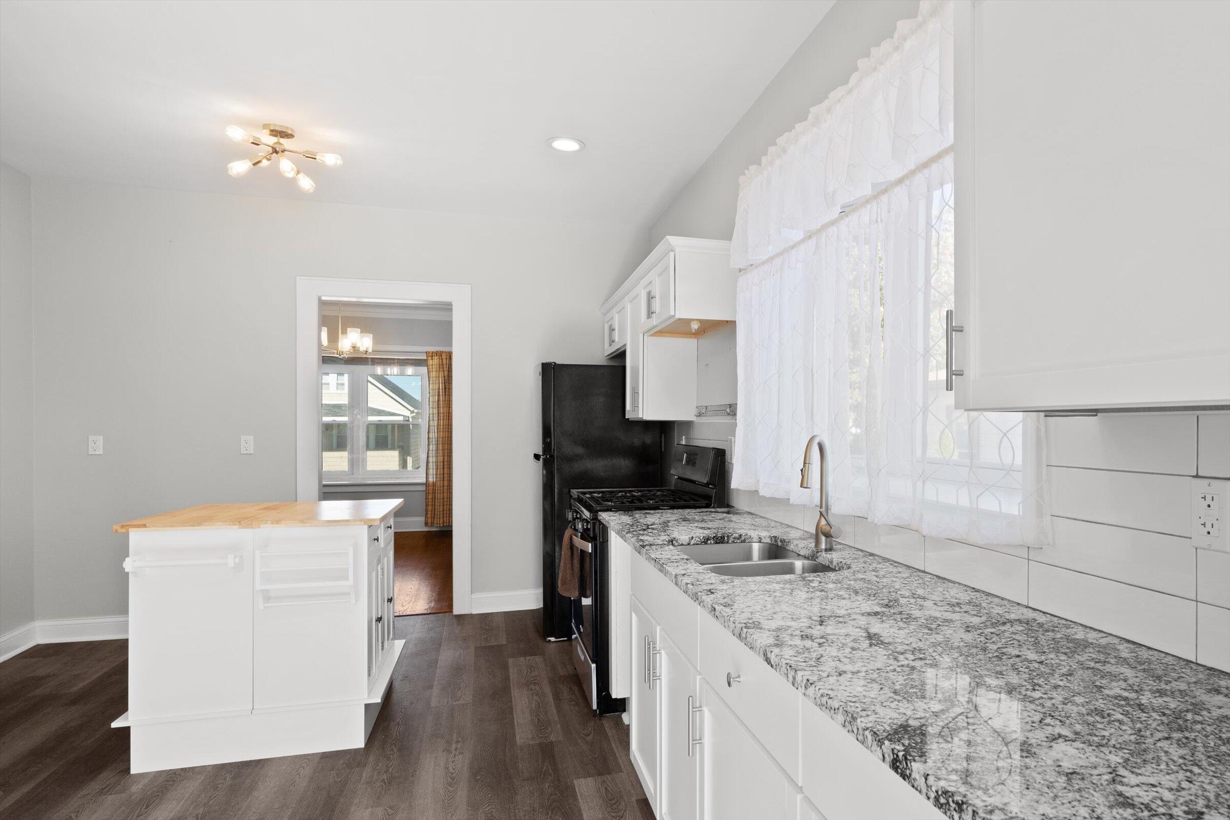 38 Condit Street Hammond, IN 46320 - Photo 11 of 36 a kitchen with a stove a sink and a refrigerator