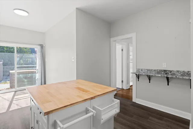 a room that has a bed and a table in it