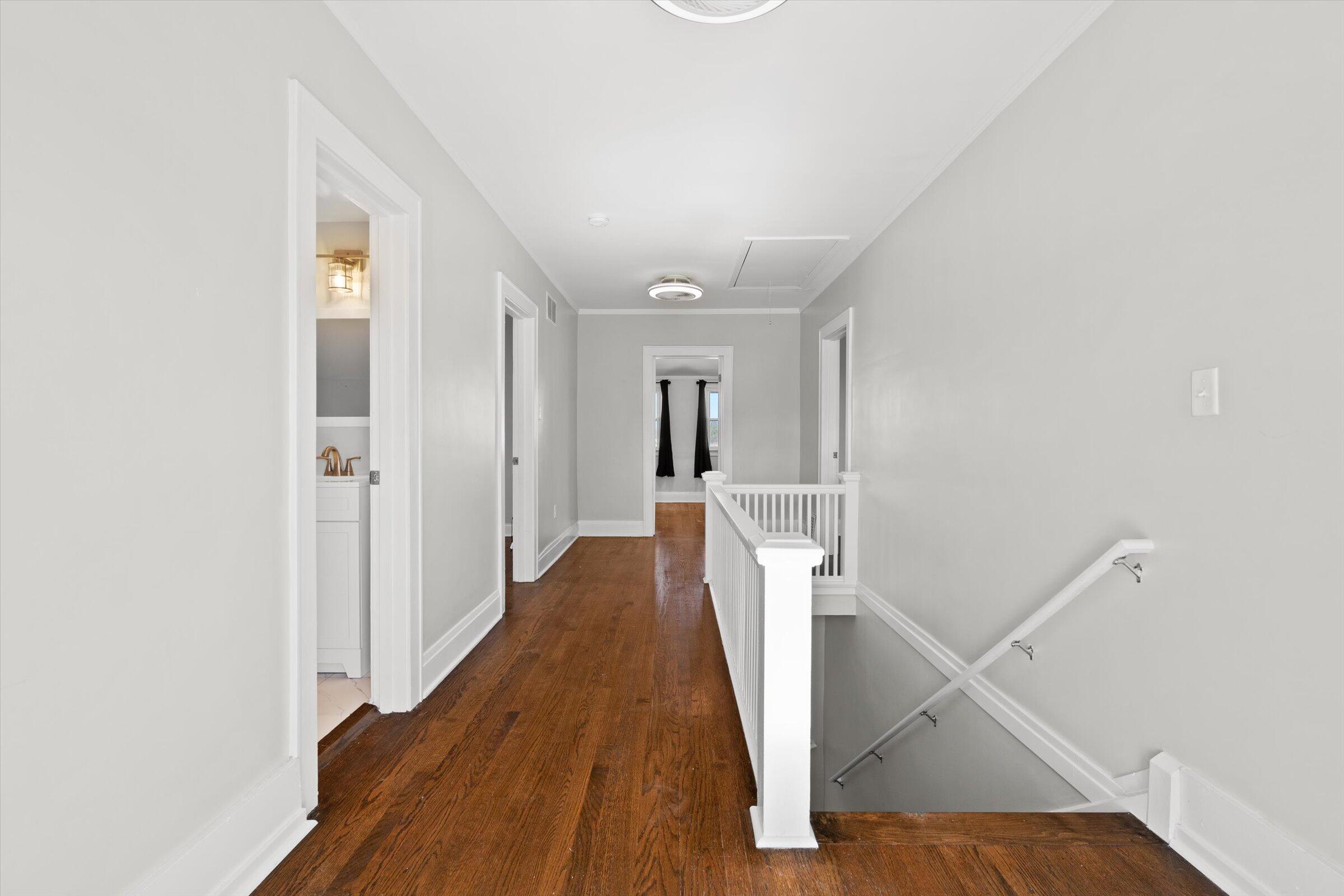 38 Condit Street Hammond, IN 46320 - Photo 19 of 36 a view of a hallway with white walls and wooden floor