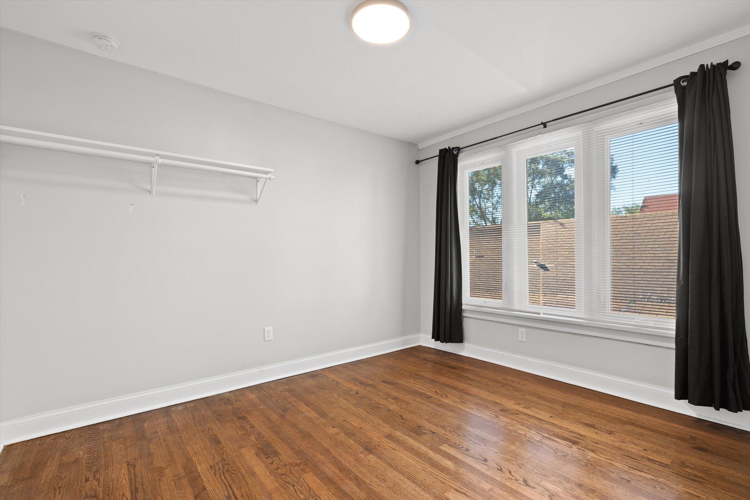38 Condit Street Hammond, IN 46320 - Photo 23 of 36 a view of an empty room with wooden floor and a window