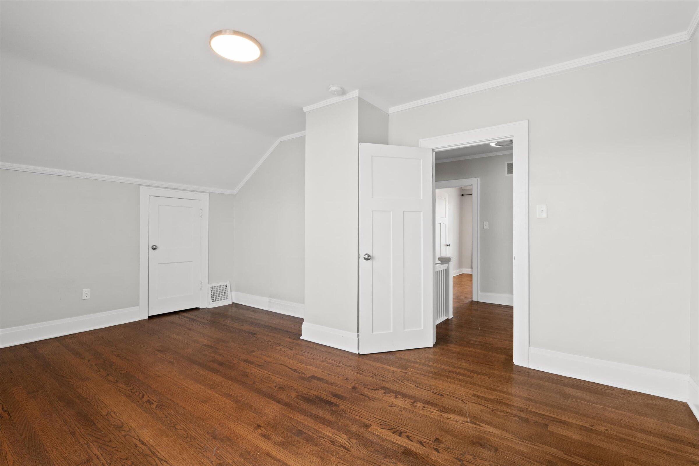 38 Condit Street Hammond, IN 46320 - Photo 26 of 36 an empty room with wooden floor & windows
