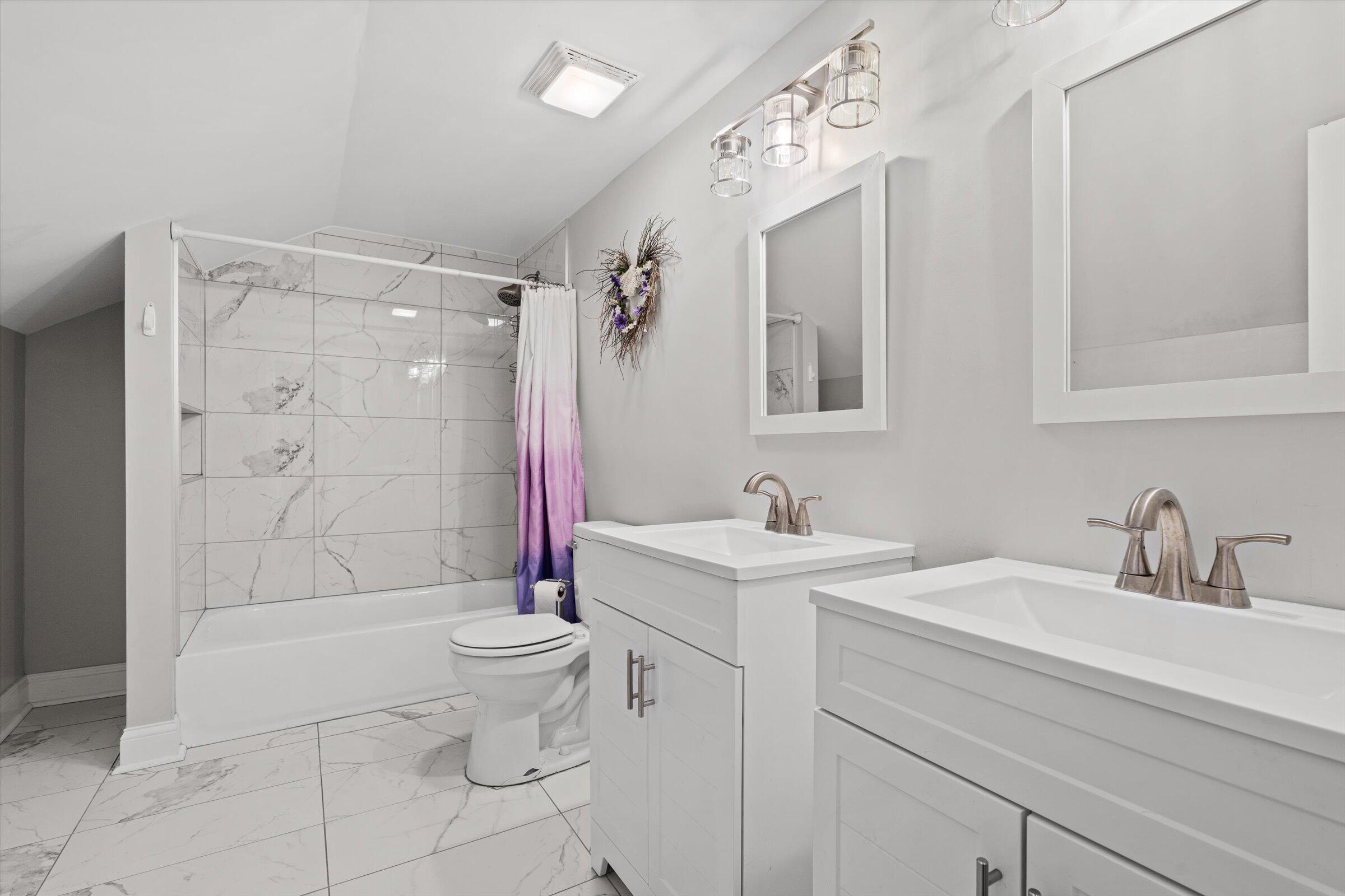 38 Condit Street Hammond, IN 46320 - Photo 27 of 36 a bathroom with a sink a toilet and shower