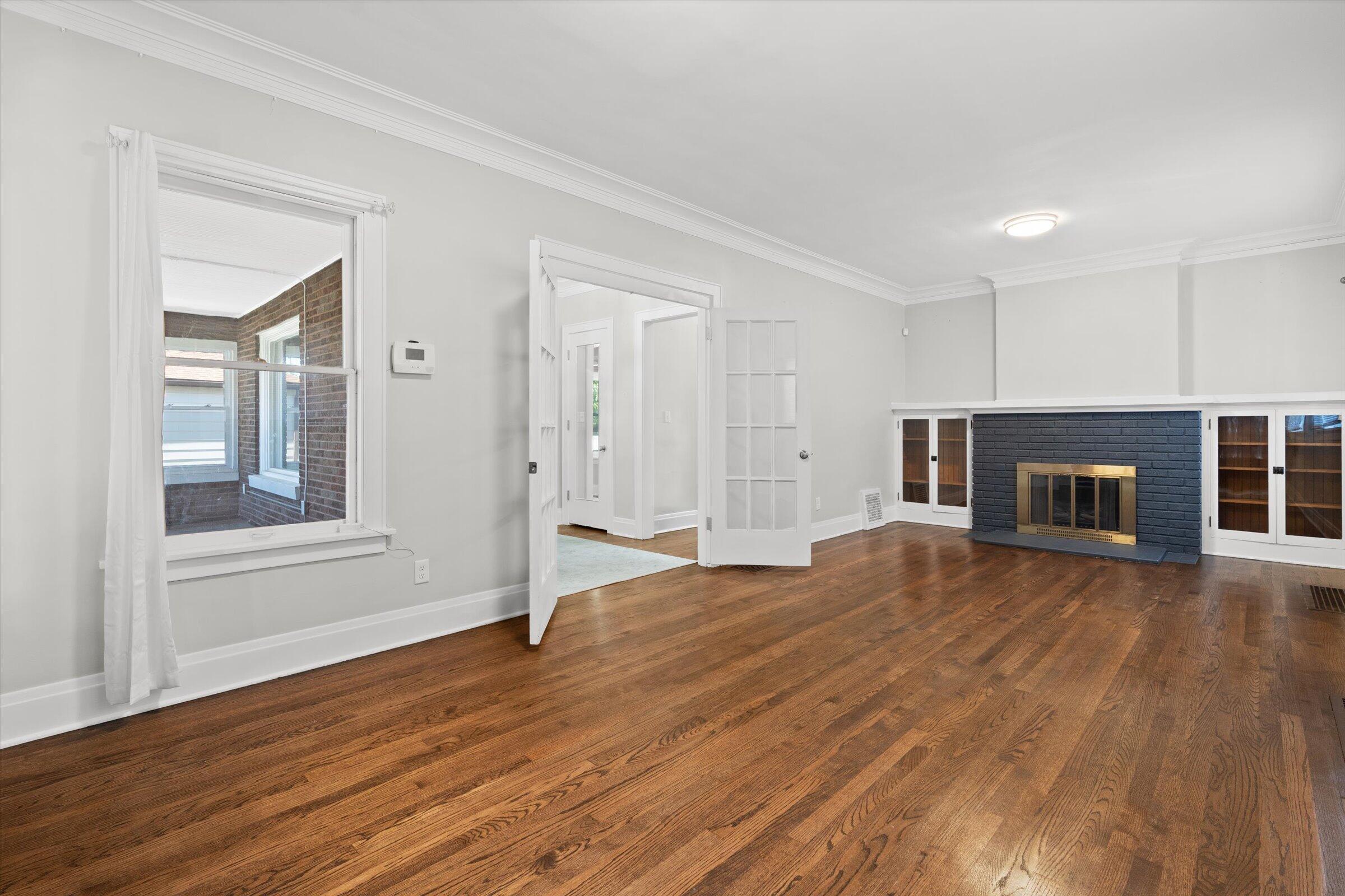 38 Condit Street Hammond, IN 46320 - Photo 5 of 36 a view of empty room with wooden floor and fireplace