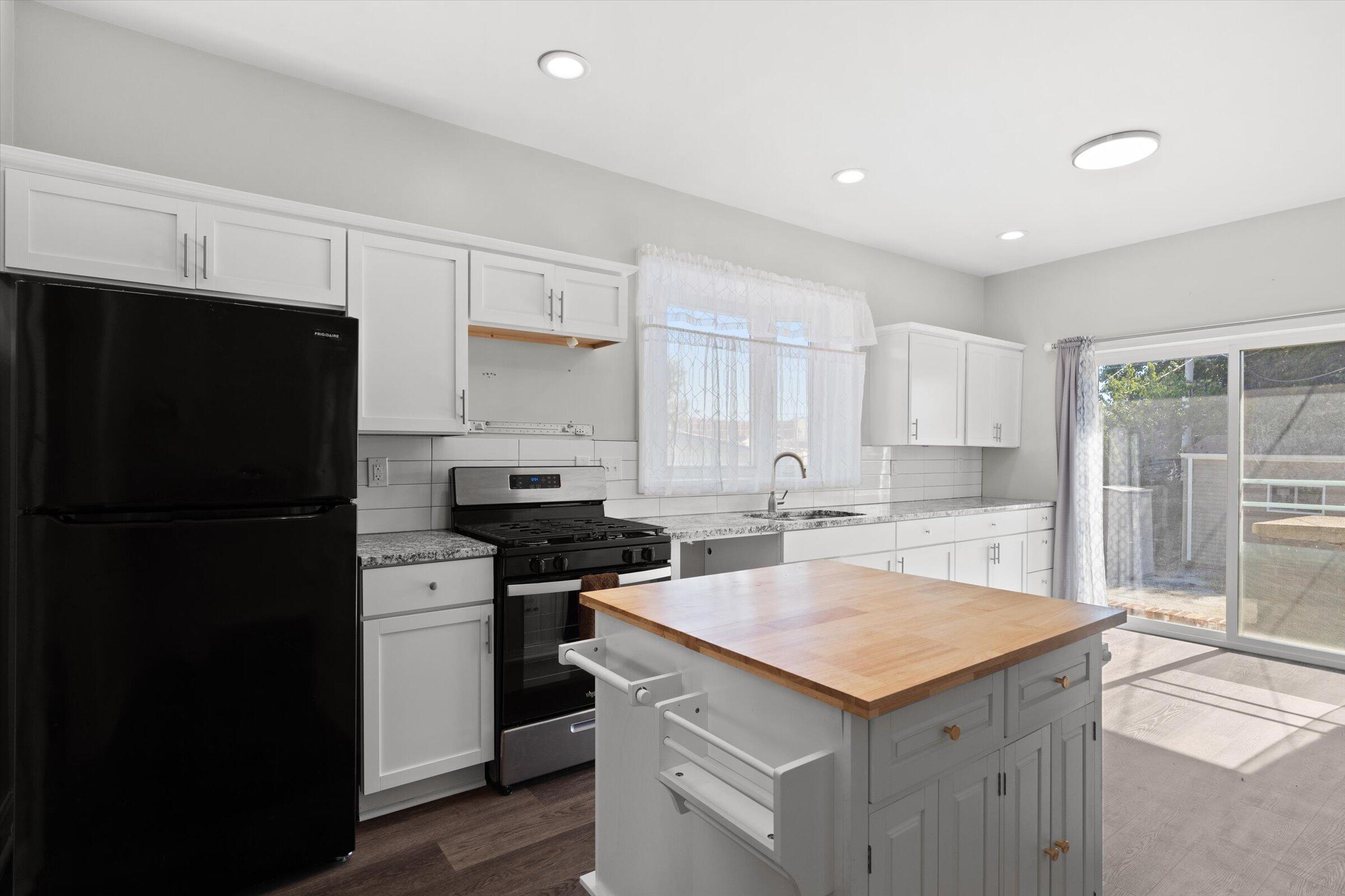 38 Condit Street Hammond, IN 46320 - Photo 10 of 36 a kitchen with a sink a stove a refrigerator and cabinets