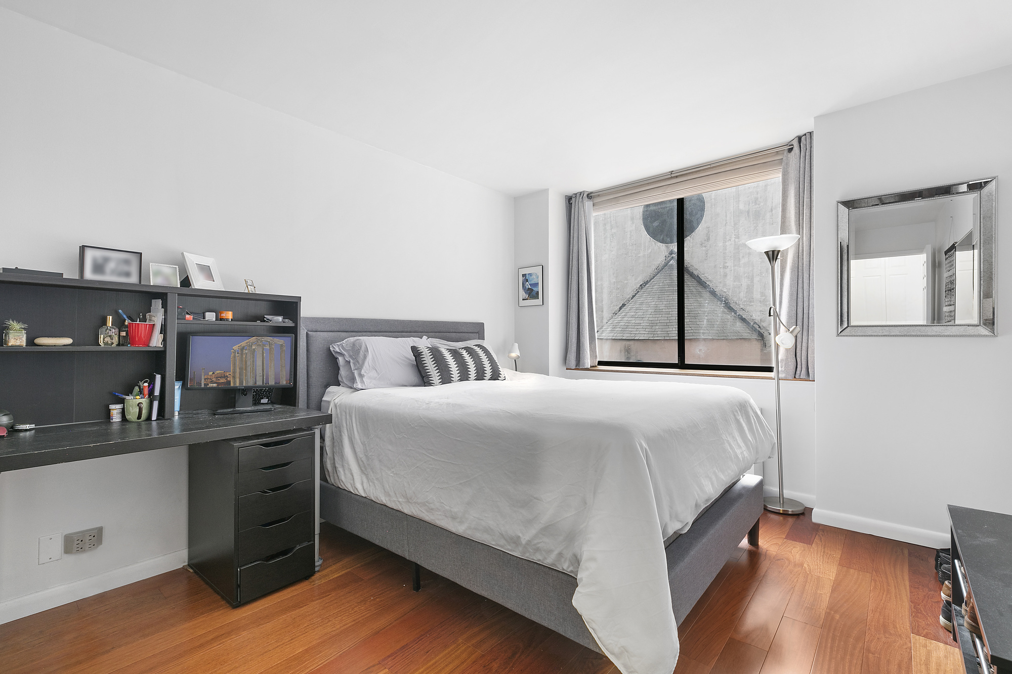 330 East 75th Street, Unit 3F Manhattan, NY 10021 - Photo 4 of 6 a bedroom with a bed and wooden floor