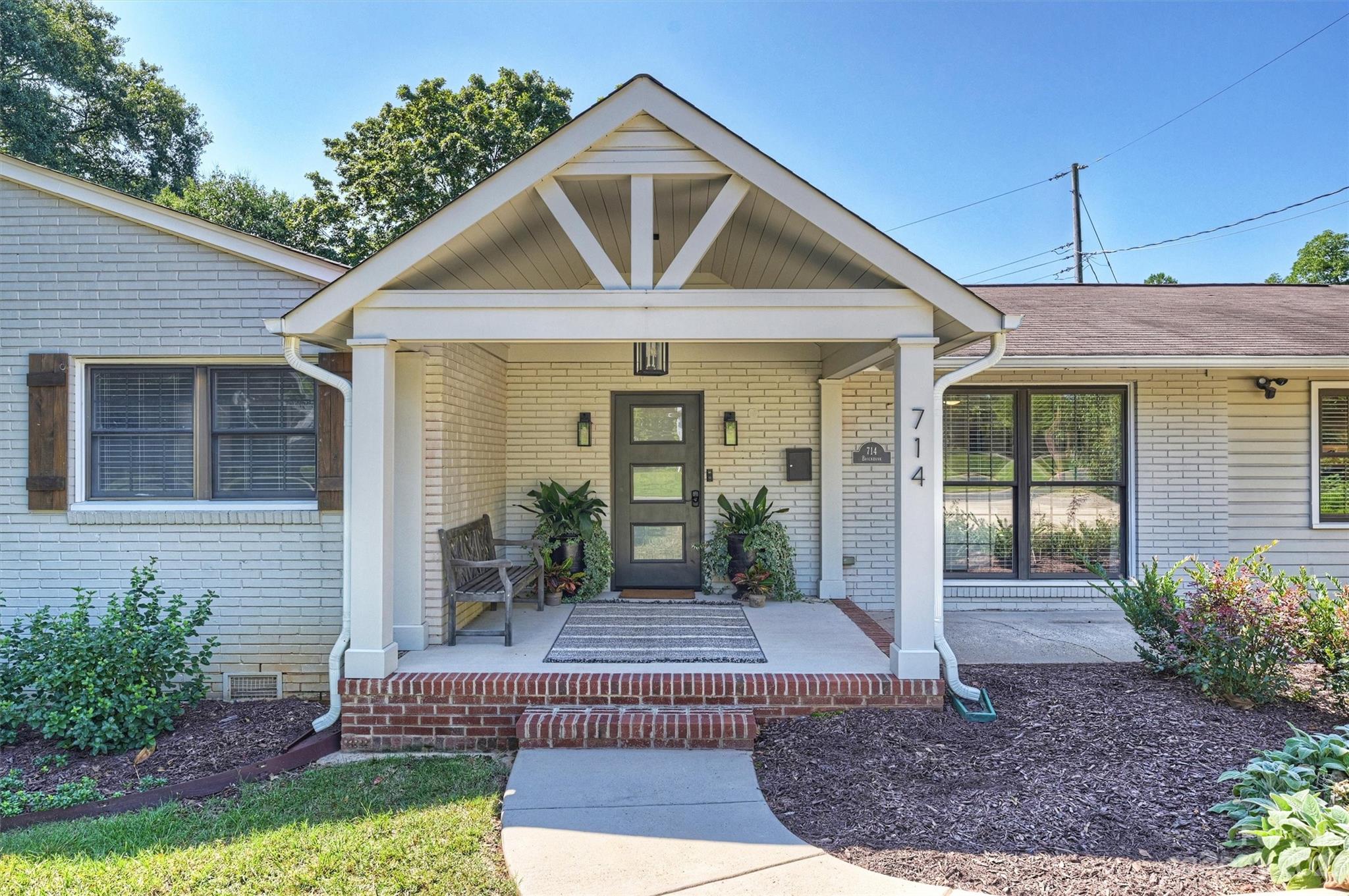 714 Brockbank Road Charlotte, NC 28209 - Photo 1 of 38 a front view of a house with garden
