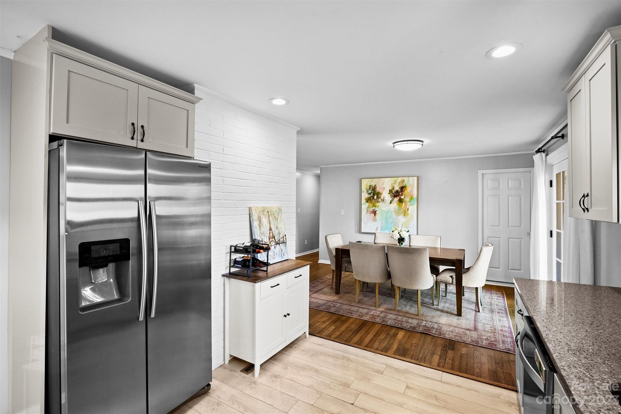 714 Brockbank Road Charlotte, NC 28209 - Photo 13 of 38 a kitchen with stainless steel appliances granite countertop a refrigerator and a stove top oven