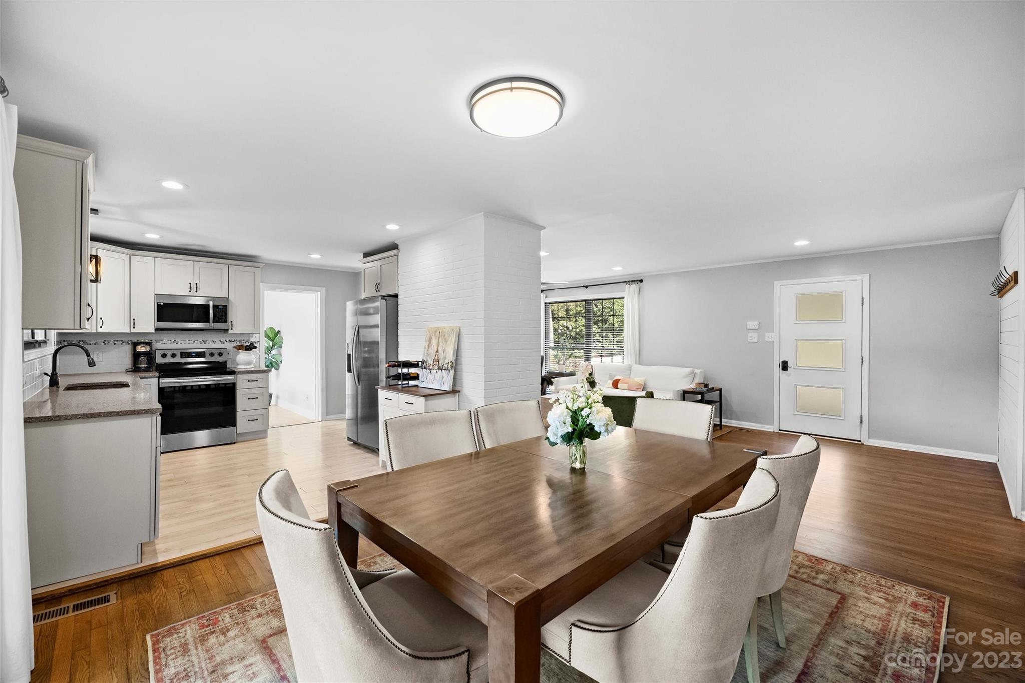 714 Brockbank Road Charlotte, NC 28209 - Photo 17 of 38 a dining room with furniture and wooden floor