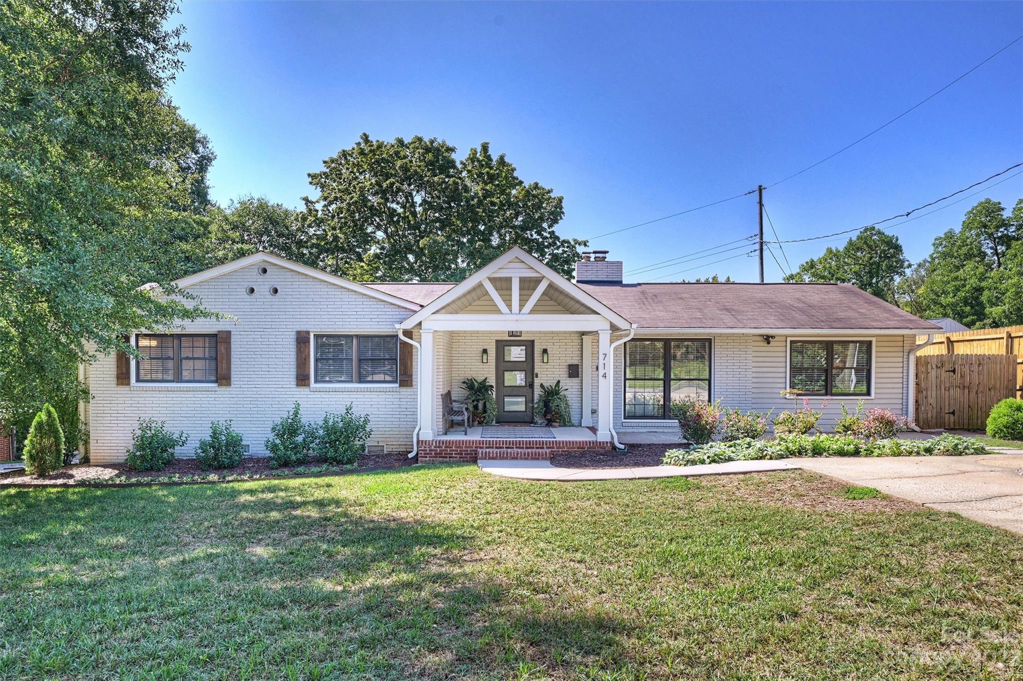714 Brockbank Road Charlotte, NC 28209 - Photo 2 of 38 a front view of a house with garden
