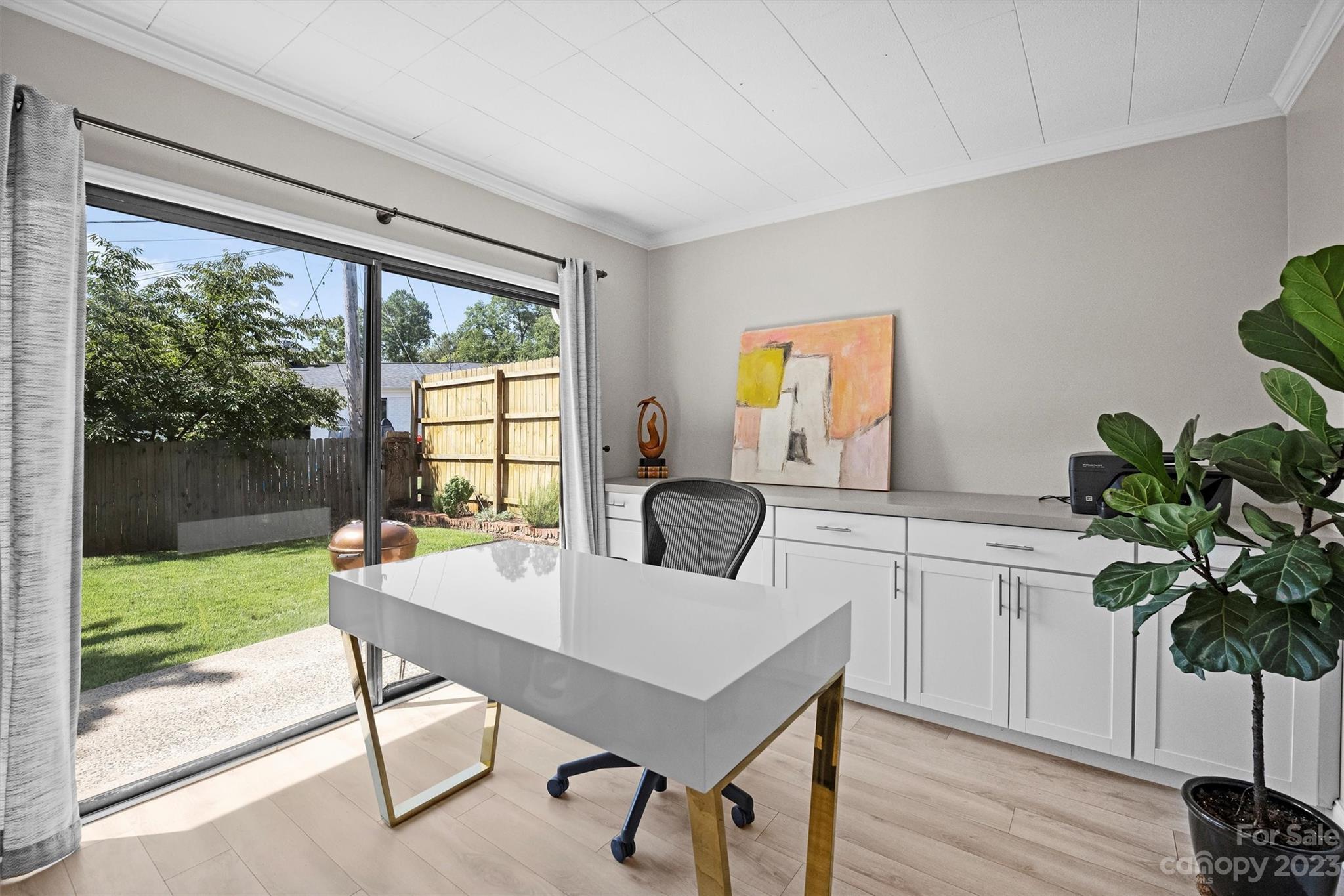 714 Brockbank Road Charlotte, NC 28209 - Photo 21 of 38 a workspace with furniture window and wooden floor