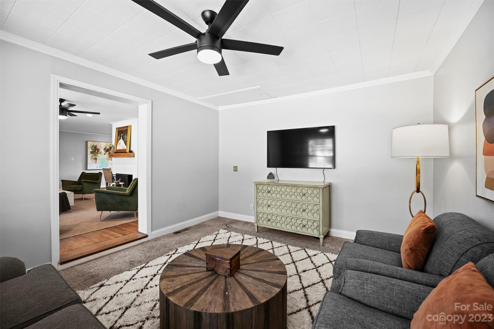 714 Brockbank Road Charlotte, NC 28209 - Photo 22 of 38 a living room with furniture and a flat screen tv