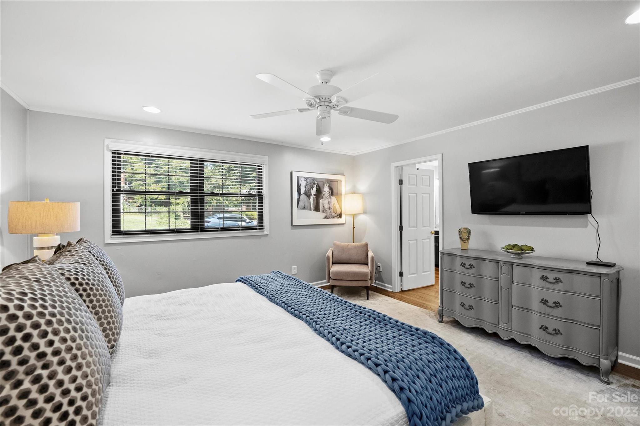 714 Brockbank Road Charlotte, NC 28209 - Photo 26 of 38 a bedroom with a bed and a flat screen tv