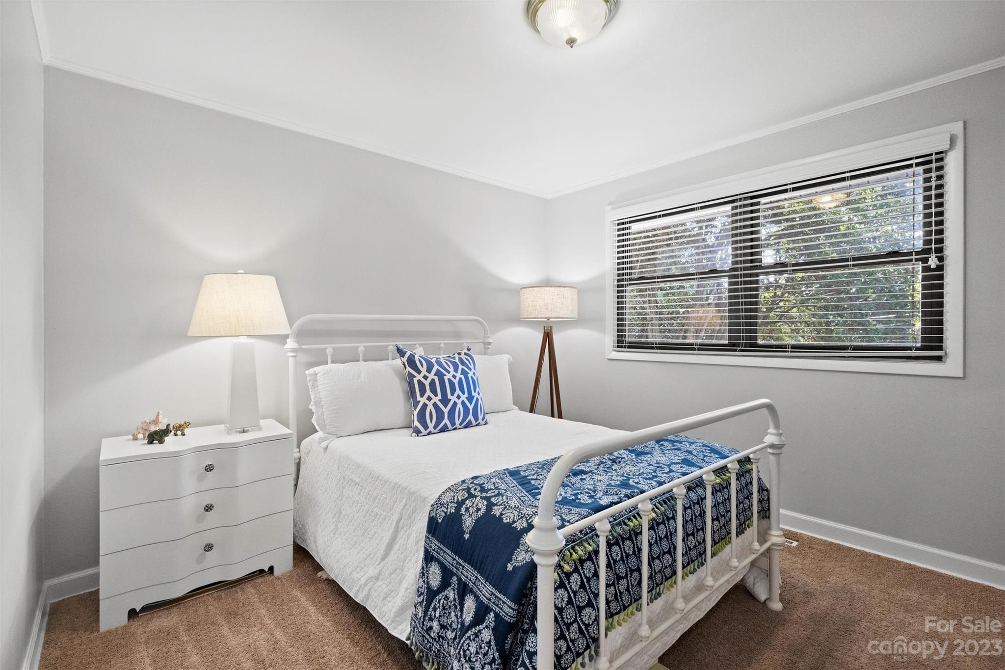 714 Brockbank Road Charlotte, NC 28209 - Photo 31 of 38 a bedroom with a bed and a window