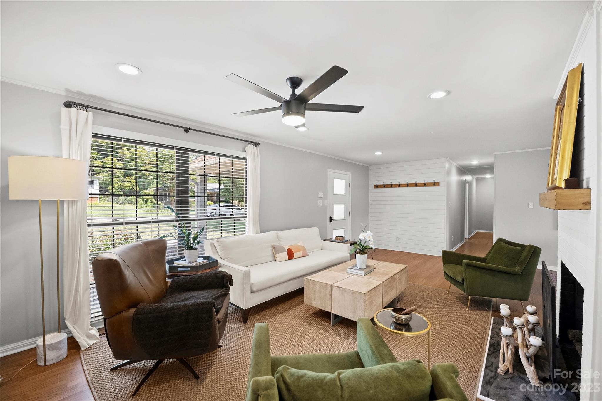 714 Brockbank Road Charlotte, NC 28209 - Photo 10 of 38 a living room with furniture and a large window