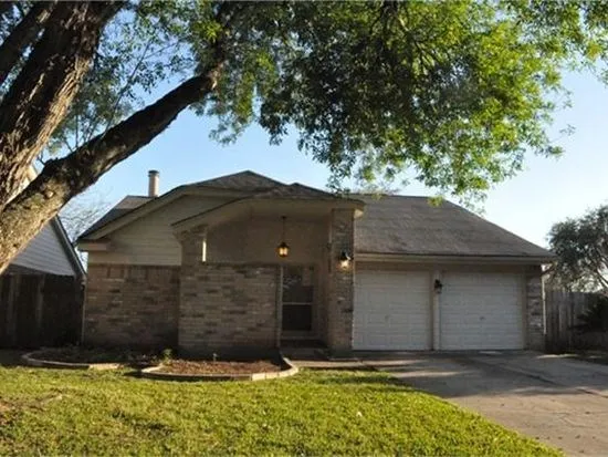 a view of a house with a small yard