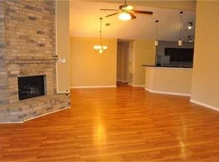 a view of a living room with a fireplace