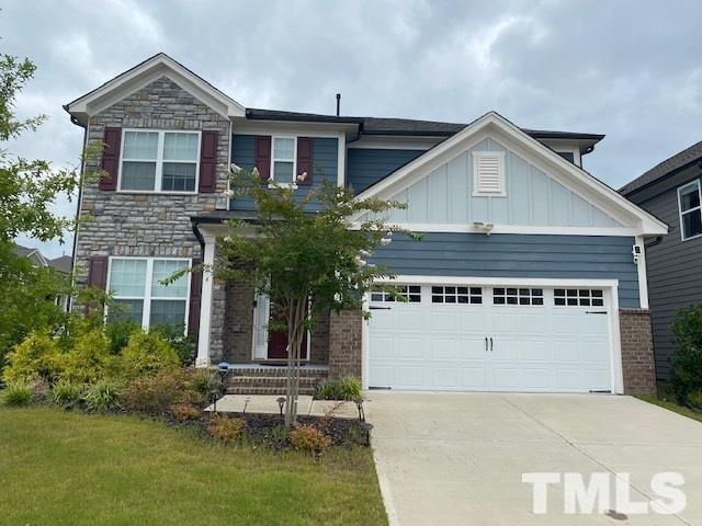 674 Brook Pine Trail Apex, NC 27523 - Photo 1 of 30 a view of a house with a yard and potted plants