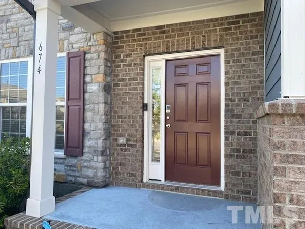 a front view of a house with a glass door