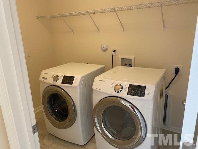 674 Brook Pine Trail Apex, NC 27523 - Photo 21 of 30 a utility room with dryer and washer