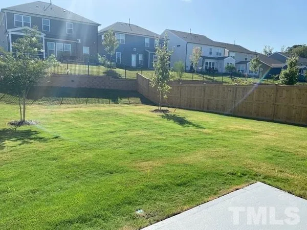 a view of a lake with a building and a big yard