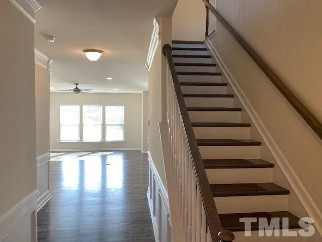 a view of entryway and hall with wooden floor