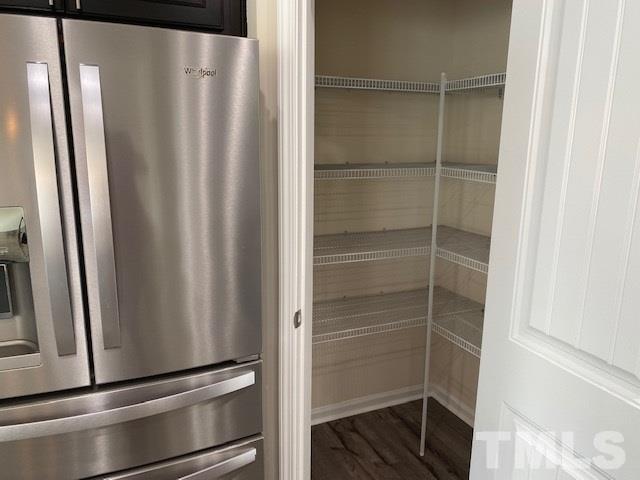 674 Brook Pine Trail Apex, NC 27523 - Photo 8 of 30 a view of walk in closet with empty racks