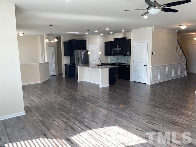 674 Brook Pine Trail Apex, NC 27523 - Photo 10 of 30 a view of kitchen with cabinets and wooden floor