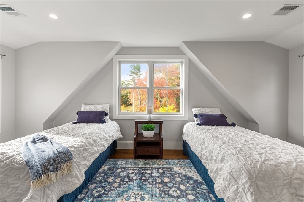 48 Graystone Lane Natick, MA 01760 - Photo 16 of 30 a bedroom with a bed and a window