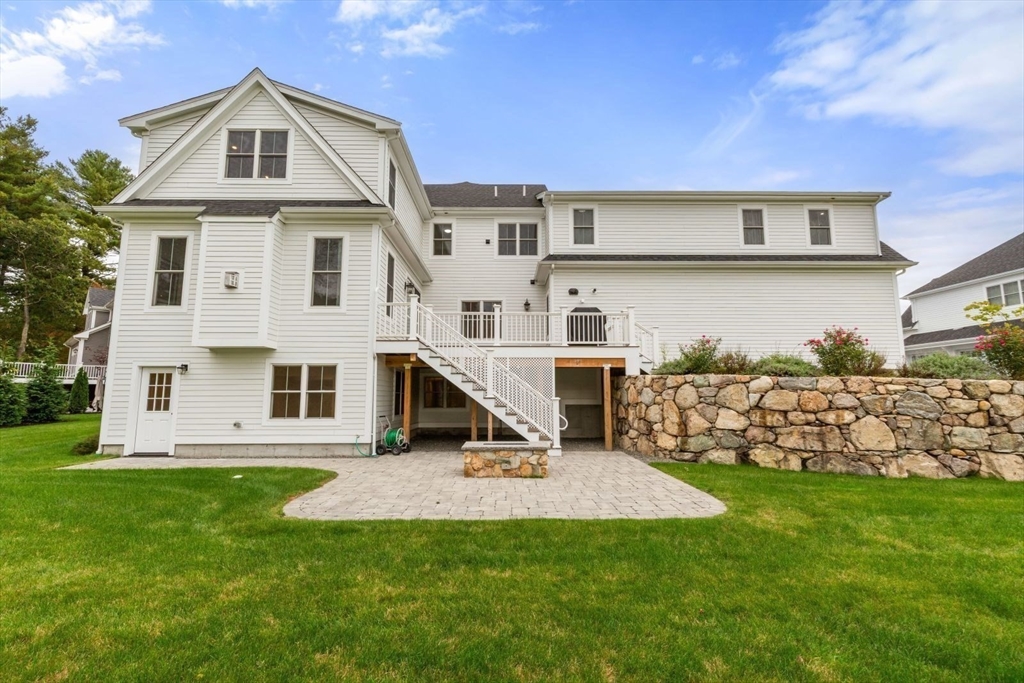 48 Graystone Lane Natick, MA 01760 - Photo 23 of 30 a front view of a house with a yard