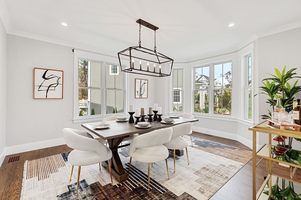 48 Graystone Lane Natick, MA 01760 - Photo 8 of 30 a view of a dining room with furniture window and wooden floor