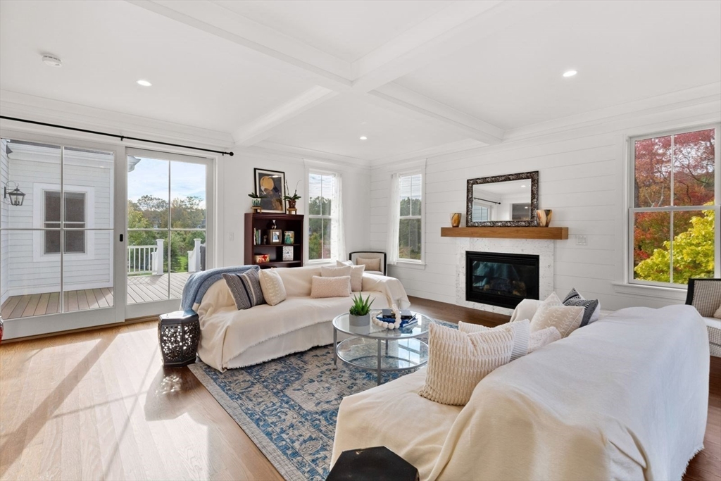 48 Graystone Lane Natick, MA 01760 - Photo 9 of 30 a living room with furniture fireplace and a large window