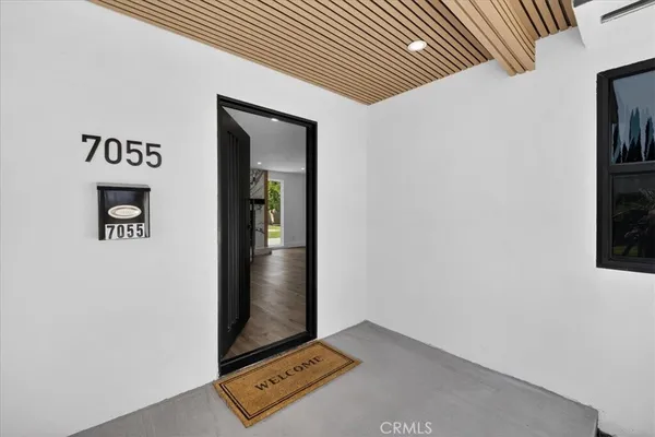an aerial view of a house with yard swimming pool and outdoor seating
