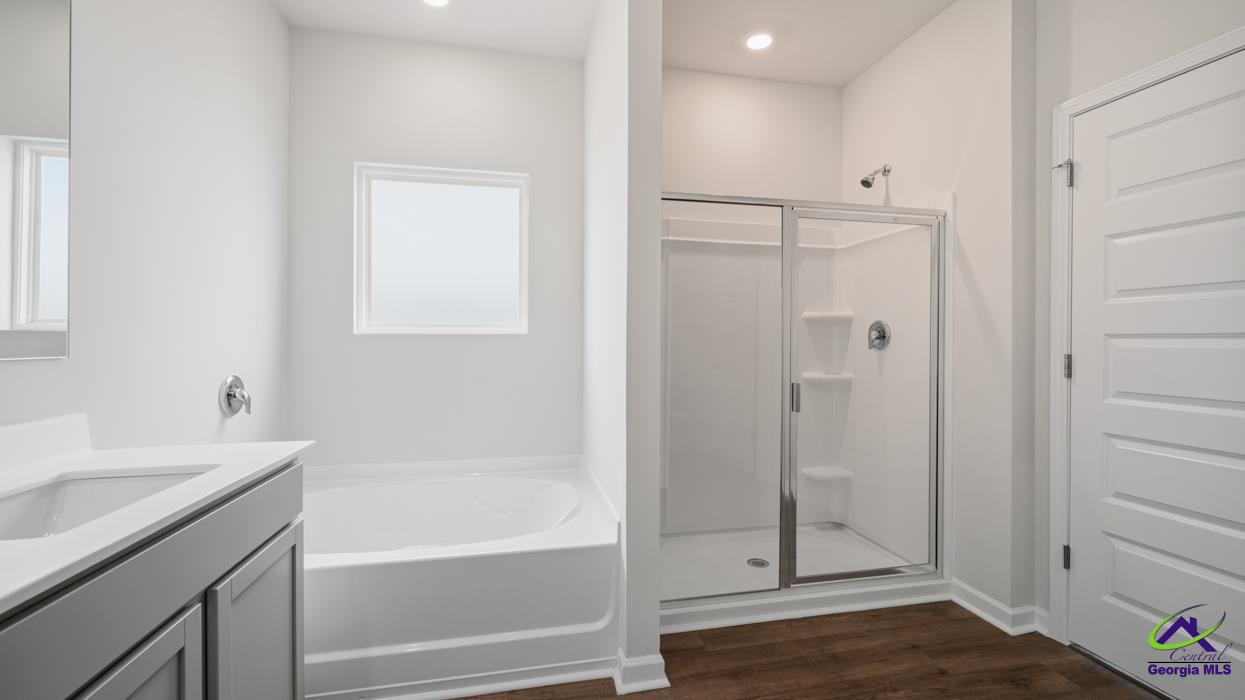 227 Cattle Drive Perry, GA 31069 - Photo 14 of 40 a bathroom with a shower and a sink
