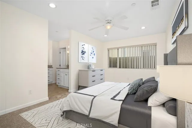 a bedroom with a bed and a couch