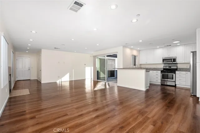 a view of kitchen with wooden floor