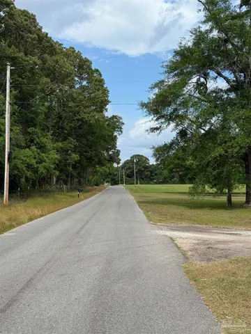 a view of a swimming pool and a yard