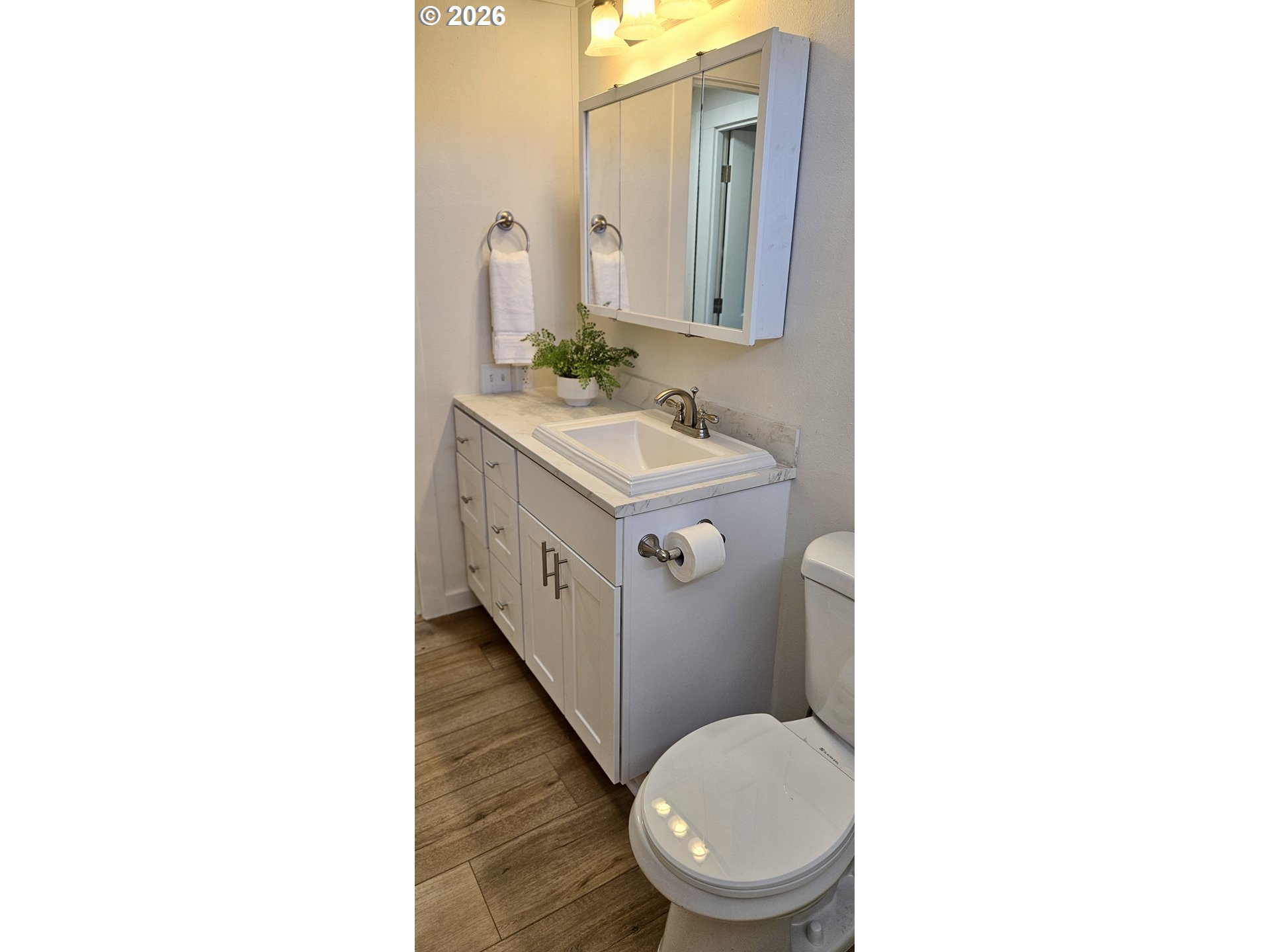 451 Lochaven Avenue Springfield, OR 97477 - Photo 16 of 21 a bathroom with a granite countertop toilet sink and mirror