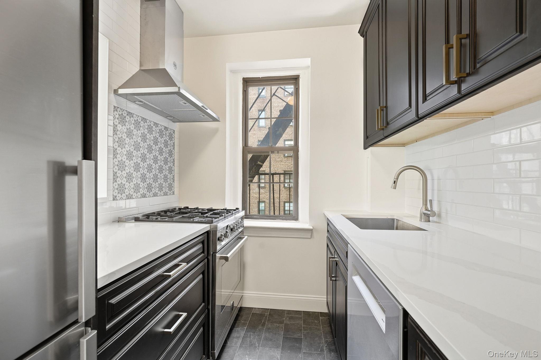 196 Garth Road, Unit 2F Scarsdale, NY 10583 - Photo 11 of 23 Kitchen with Stainless Steel Appliances
