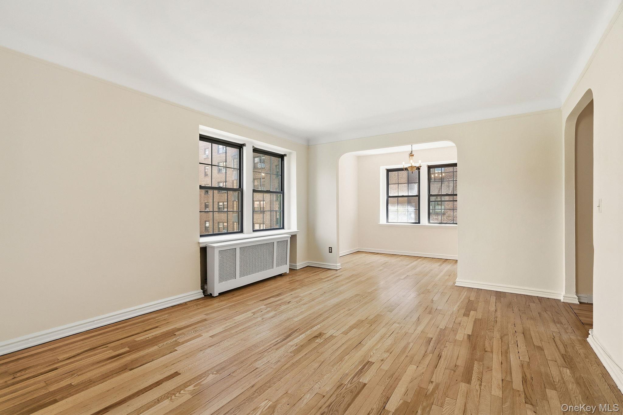 196 Garth Road, Unit 2F Scarsdale, NY 10583 - Photo 6 of 23 Alternate View Living Room with Dining Room