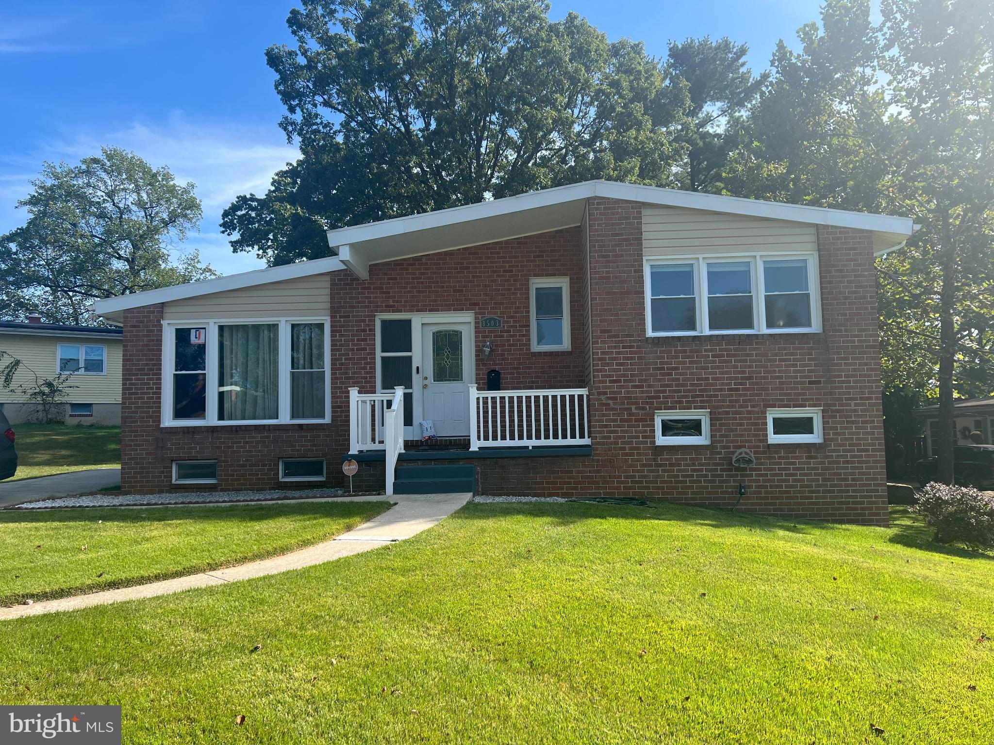8503 Stevenswood Road Windsor Mill, MD 21244 - Photo 5 of 18 Charming brick home with lush green lawn.