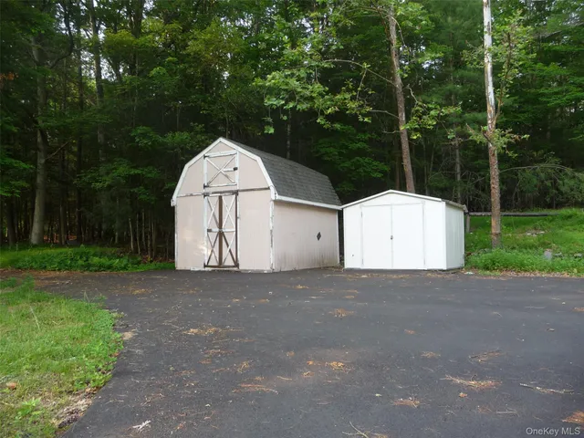 a view of garage and yard
